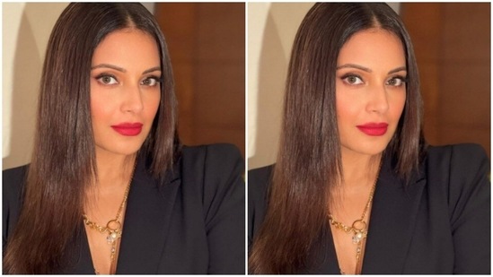 Bipasha accessorised her boss lady look with contrasting gold neck chain and a gold ring from the house of Outhouse Jewellery.(Instagram/@bipashabasu)