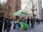 People line up for PCR and Rapid Antigen Covid-19 tests on Wall Street in the Financial District in New York on Thursday.(AP Photo)