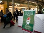 A sign asking people to wear face coverings to curb the spread of coronavirus at London St Pancras International rail station, in London, the Eurostar hub to travel to European countries including France, Friday, Dec. 17, 2021. After the UK recorded its highest number of confirmed new Covid-19 infections since the pandemic began, France announced Thursday that it would tighten entry rules for those coming from Britain. Hours later, the country set another record, with a further 88,376 confirmed Covid-19 cases reported Thursday, almost 10,000 more than the day before (AP Photo/Matt Dunham)