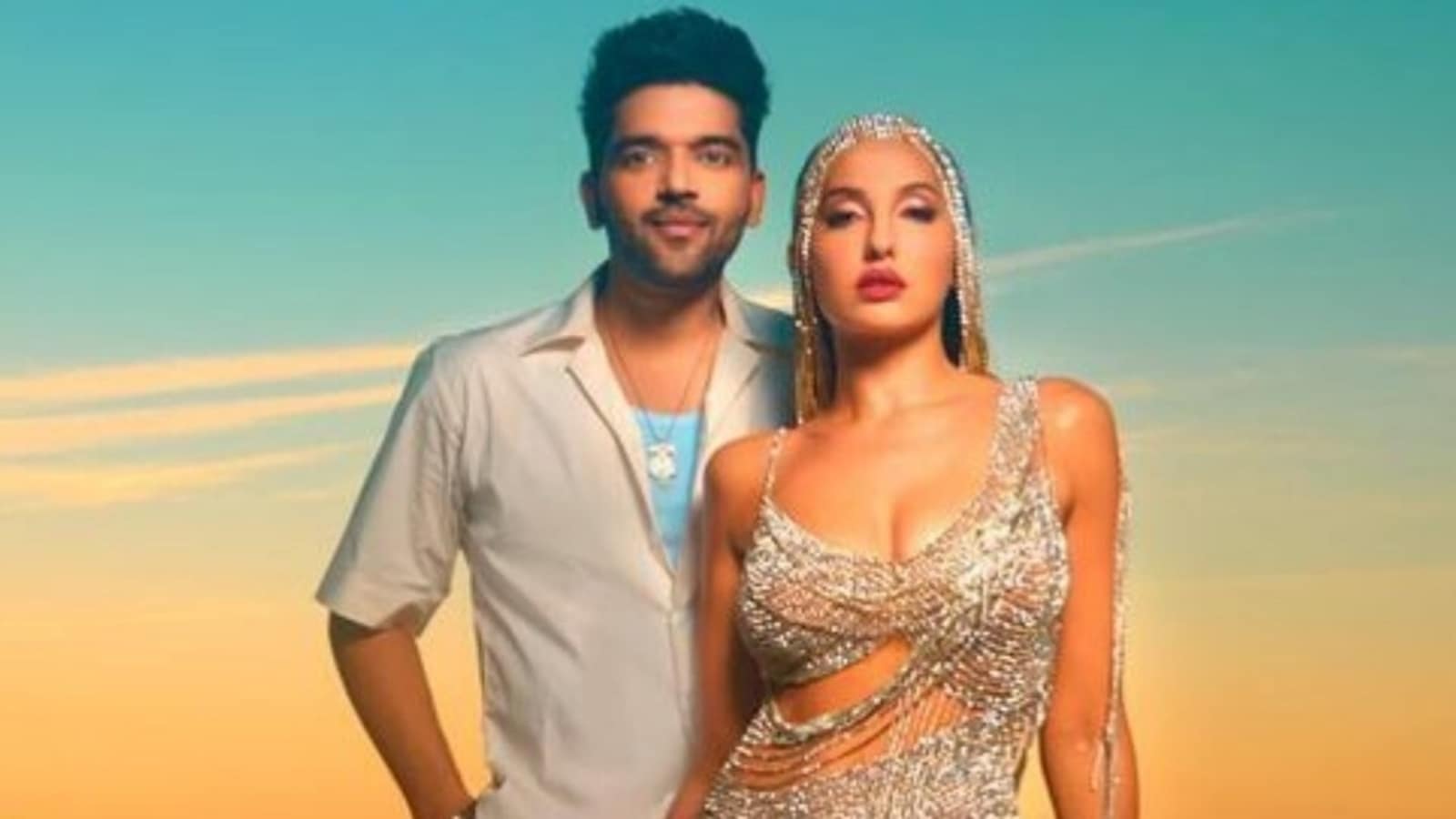 Nora Fatehi is a vision in silver cut-out dress with Guru Randhawa ...