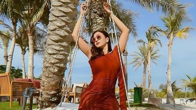 Gauahar Khan's viral pictures from Abu Dhabi in ₹9.5k rust dress is a lesson in fluid dressing (Instagram/labelnaka) Gauahar Khan's viral pictures from Abu Dhabi in ₹9.5k rust dress is a lesson in fluid dressing (Instagram/labelnaka)