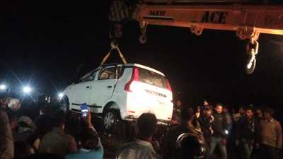 Three occupants of the car were rescued by police with help of locals and were taken to a hospital for treatment in Lucknow. (HT) Three occupants of the car were rescued by police with help of locals and were taken to a hospital for treatment in Lucknow. (HT)