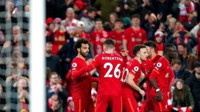 Liverpool's Mohamed Salah celebrates with teammates after scoring his side's second goal during the English Premier League soccer match between Liverpool and Newcastle United at Anfield stadium in Liverpool, England. (AP) Liverpool's Mohamed Salah celebrates with teammates after scoring his side's second goal during the English Premier League soccer match between Liverpool and Newcastle United at Anfield stadium in Liverpool, England. (AP)