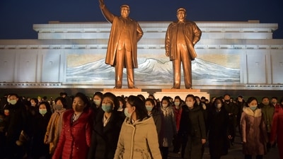 People come to pay their respects before the statues of late North Korean leaders Kim Il Sung and Kim Jong il to mark the 10th death anniversary of Kim Jong un's father, Kim Jong il. (AFP) People come to pay their respects before the statues of late North Korean leaders Kim Il Sung and Kim Jong il to mark the 10th death anniversary of Kim Jong un's father, Kim Jong il. (AFP)