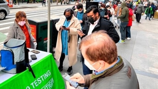 People wait in line for a Covid-19 test, in New York on Thursday. (AP Photo)