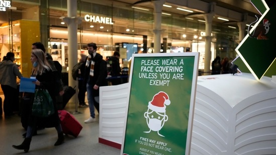 A sign asking people to wear face coverings to curb the spread of coronavirus at London St Pancras International rail station, in London, the Eurostar hub to travel to European countries including France, Friday, Dec. 17, 2021. After the UK recorded its highest number of confirmed new Covid-19 infections since the pandemic began, France announced Thursday that it would tighten entry rules for those coming from Britain. Hours later, the country set another record, with a further 88,376 confirmed Covid-19 cases reported Thursday, almost 10,000 more than the day before&nbsp;(AP Photo/Matt Dunham)