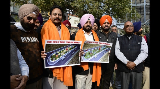 Councillor Parvinder Lapran meeting with shopkeepers regarding the Clock Tower project at Gol Market in Model Town, Ludhiana, on Friday. (Harsimar Pal Singh/HT)