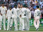 Australia's Nathan Lyon celebrates taking the wicket of England's Ollie Robinson with teammates