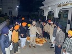 Activists of various Sikh organisations gather outside the Golden Temple after a man was beaten to death at the temple premises for alleged sacrilege, in Amritsar.&nbsp;