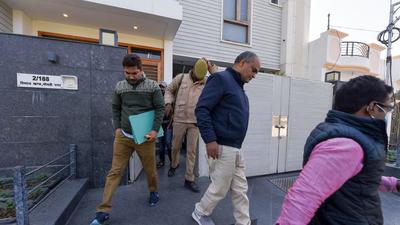 Income Tax department officers come out after a raid at the residence of Jainendra Yadav, Private Secretary to Samajwadi Party President Akhilesh Yadav, in Lucknow on Saturday. (PTI) Income Tax department officers come out after a raid at the residence of Jainendra Yadav, Private Secretary to Samajwadi Party President Akhilesh Yadav, in Lucknow on Saturday. (PTI)