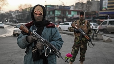 Taliban fighters stand guard at a checkpoint on a street in Kabul on December 17, 2021. (AFP) Taliban fighters stand guard at a checkpoint on a street in Kabul on December 17, 2021. (AFP)