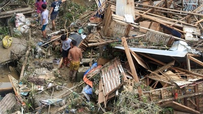 Residents salvage belongings from their destroyed houses at Talisay in Cebu province on December 17, 2021, a day after Super Typhoon Rai hit. (AFP) Residents salvage belongings from their destroyed houses at Talisay in Cebu province on December 17, 2021, a day after Super Typhoon Rai hit. (AFP)