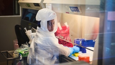 A technician wearing a full-body protection suit works inside a fume cabinet in a biosafety level 3 Covid-19 research laboratory at the African Health Research Institute (AHRI) in Durban, South Africa. (Bloomberg) A technician wearing a full-body protection suit works inside a fume cabinet in a biosafety level 3 Covid-19 research laboratory at the African Health Research Institute (AHRI) in Durban, South Africa. (Bloomberg)