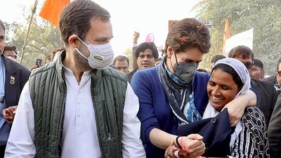 Congress General Secretary Priyanka Gandhi Vadra shares a light moment with a woman as party leader Rahul Gandhi looks on at ‘Pratigya Padyatra’, in Amethi on Saturday. (ANI) Congress General Secretary Priyanka Gandhi Vadra shares a light moment with a woman as party leader Rahul Gandhi looks on at ‘Pratigya Padyatra’, in Amethi on Saturday. (ANI)