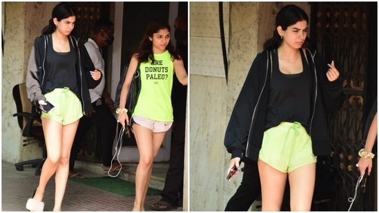 Khushi blended style and comfort for the gym today. She wore a solid black tank top paired with neon green gym shorts, flaunting her long legs and statuesque frame. A black open zipper jacket layered on top of the gym outfit completed Khushi's workout look.(HT Photos/Varinder Chawla)