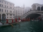 People dressed as Santa Claus row during a Christmas regatta in Venice, Italy, December 19, 2021. Italy eyes new Covid-19 travel measures to curb Omicron spread