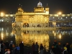 Sikh devotees pay respect at the Golden Temple in Amritsar on December 18, 2021.
