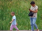 According to the study, mothers talked up to four times less with their children while they were on their smartphone According to the study, mothers talked up to four times less with their children while they were on their smartphone