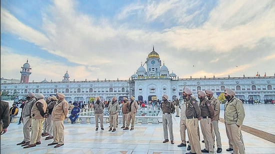 Police at Golden Temple ahead of Punjab chief minister Charanjit Singh Channi's visit, in Amritsar, on Sunday. (PTI)