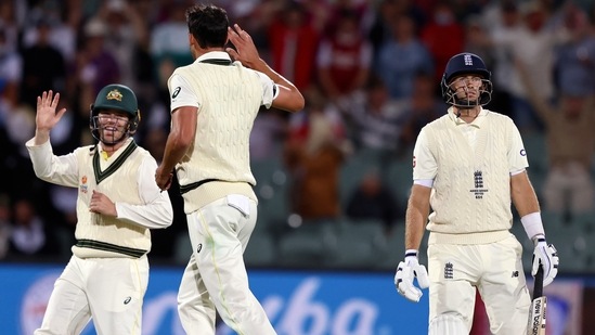 Australia's Mitchell Starc, center, celebrates after taking the wicket of England's Joe Root, right, during the fourth day of their Ashes cricket test match in Adelaide, Australia, Sunday, Dec. 19, 2021. (AP) Australia's Mitchell Starc, center, celebrates after taking the wicket of England's Joe Root, right, during the fourth day of their Ashes cricket test match in Adelaide, Australia, Sunday, Dec. 19, 2021. (AP)