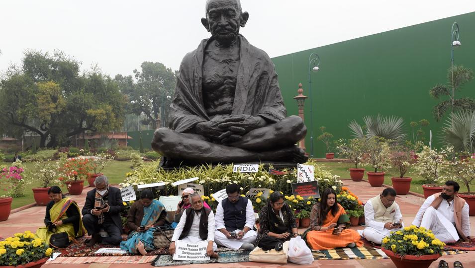 Suspended Rajya Sabha MPs from opposition parties protest near Mahatma Gandhi statue at Parliament House. (HT File Photo) Suspended Rajya Sabha MPs from opposition parties protest near Mahatma Gandhi statue at Parliament House. (HT File Photo)