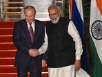 Prime Minister Narendra Modi greets Russian president Vladimir Putin before a meeting at Hyderabad House in New Delhi.(AFP)