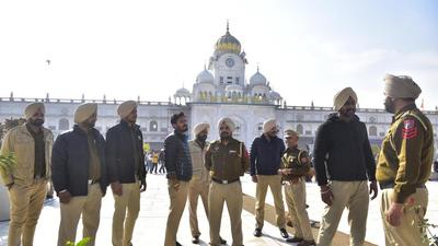 Punjab police personnel deployed outside Golden Temple after the sacrilege bid, in Amritsar on December 19. (Sameer Sehgal /HT photo)