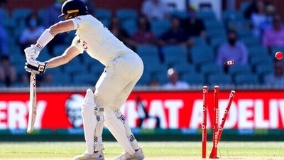 England's Chris Woakes is bowled by Australia's Jhye Richardson during the fifth day of their Ashes cricket test match in Adelaide, Australia, Monday, Dec. 20 (AP) England's Chris Woakes is bowled by Australia's Jhye Richardson during the fifth day of their Ashes cricket test match in Adelaide, Australia, Monday, Dec. 20 (AP)