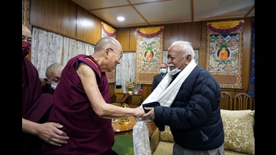RSS chief Mohan Bhagwat with Tiebtan spiritual leader the Dalai Lama at McLeodganj on Monday. (HT Photo)