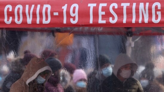 People queue to be tested for Covid-19 in Times Square, as the Omicron coronavirus variant continues to spread in Manhattan, New York City,(REUTERS)