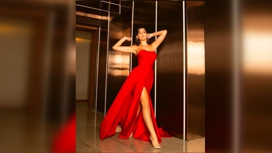 Nora Fatehi is ready to take over the world in red thigh-high slit gown