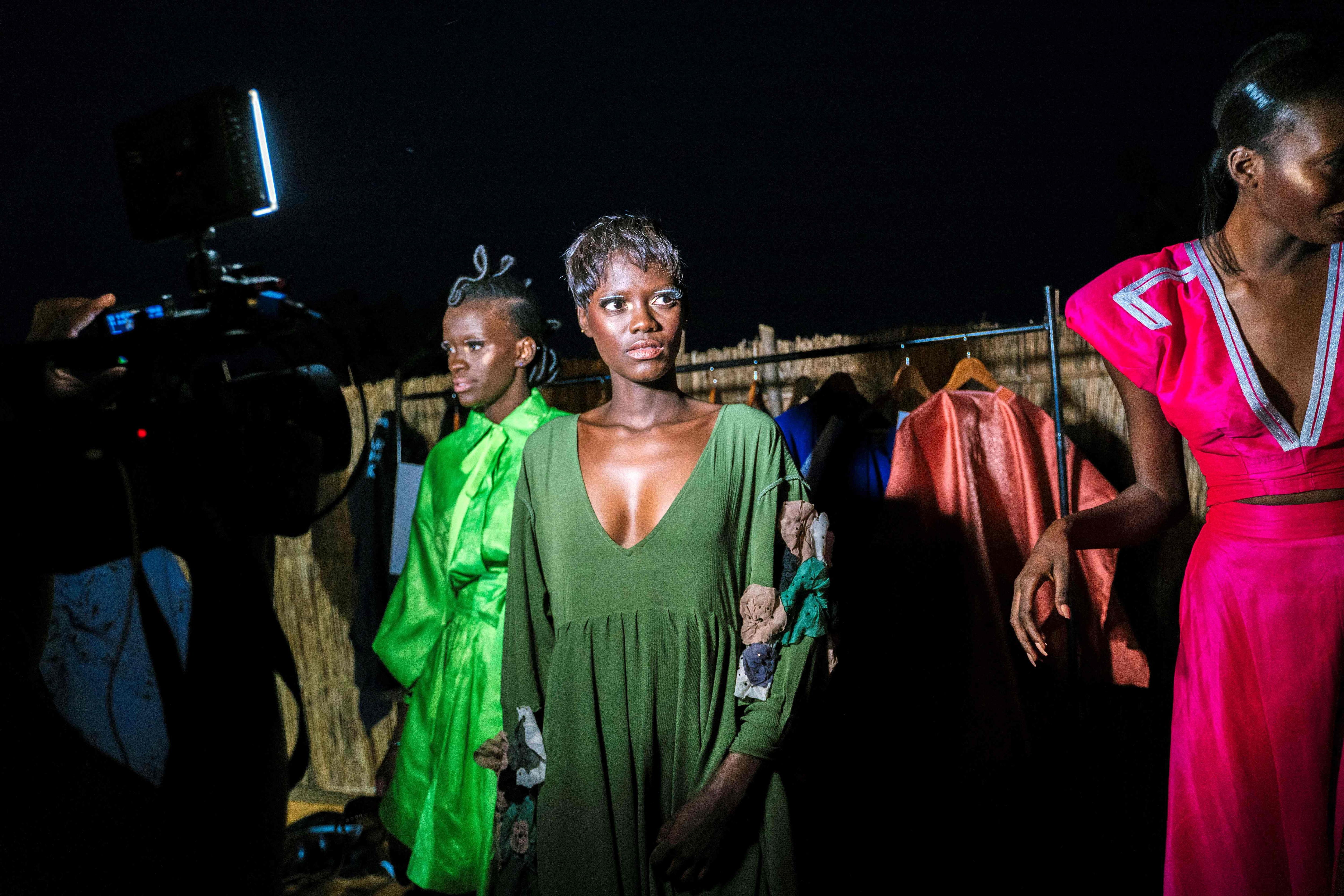 Models wait backstage during the 19th Dakar Fashion Week held at the Baobad forest in Nguekhokh.(AFP)
