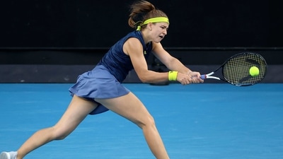 Czech Republic's Karolina Muchova hits a return against Belgium's Elise Mertens (AFP)