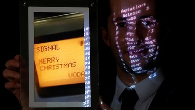 Aguttes auction house head of development Maximilien Aguttes holds a non-fungible token (NFT), replica of the original communication protocol that transmitted the first SMS text message ever sent, before its auction by Britain's Vodafone, in Neuilly-sur-Seine, near Paris, France (REUTERS)