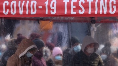 People queue to be tested for Covid-19 in Times Square, as the Omicron coronavirus variant continues to spread in Manhattan, New York City, (REUTERS)