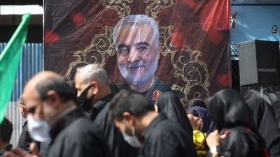 A poster of the late Iran's Quds Force top commander Qassem Soleimani is seen while Iranian people commemorate Arbaeen in Tehran, Iran (REUTERS)