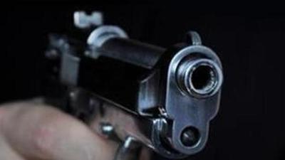 Shooting a gun in night (Getty Images/iStockphoto)