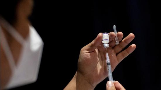 A healthworker prepares a dose of Covid-19 vaccine. When asked whether the municipal bodies have sent a requisition to the Centre seeking funds, SDMC standing committee chairman BK Oberoi said the aid is extended only to municipalities in states, and not to those in Union territories such as Delhi. (Representational image/REUTERS)