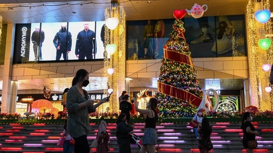 People walk past Christmas decorations at the Orchard road shopping district in Singapore.(AFP Photo) People walk past Christmas decorations at the Orchard road shopping district in Singapore.(AFP Photo)