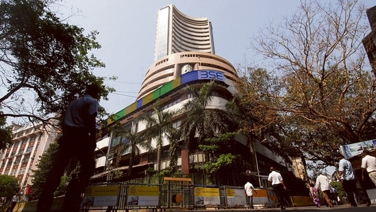 Sensex jumps over 490 points to end day at 56,319; Nifty closes below 17,000.