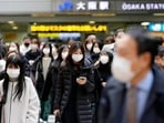 People wearing face masks cross a street near JR Osaka Station in Osaka, western Japan(AP) People wearing face masks cross a street near JR Osaka Station in Osaka, western Japan(AP)