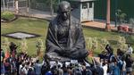 Opposition leaders read the Preamble to the Constitution of India, and recite the national anthem before the Mahatma Gandhi statue in Parliament on Wednesday. (PTI) Opposition leaders read the Preamble to the Constitution of India, and recite the national anthem before the Mahatma Gandhi statue in Parliament on Wednesday. (PTI)
