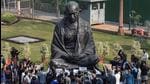 Opposition leaders, including the leader of Opposition Rajya Sabha, Mallikarjun Kharge, along with suspended MPs, read the Preamble to the Constitution and recite the national anthem before the Mahatma Gandhi statue in Parliament to protest the suspension of 12 lawmakers, in New Delhi on Wednesday. (PTI) Opposition leaders, including the leader of Opposition Rajya Sabha, Mallikarjun Kharge, along with suspended MPs, read the Preamble to the Constitution and recite the national anthem before the Mahatma Gandhi statue in Parliament to protest the suspension of 12 lawmakers, in New Delhi on Wednesday. (PTI)