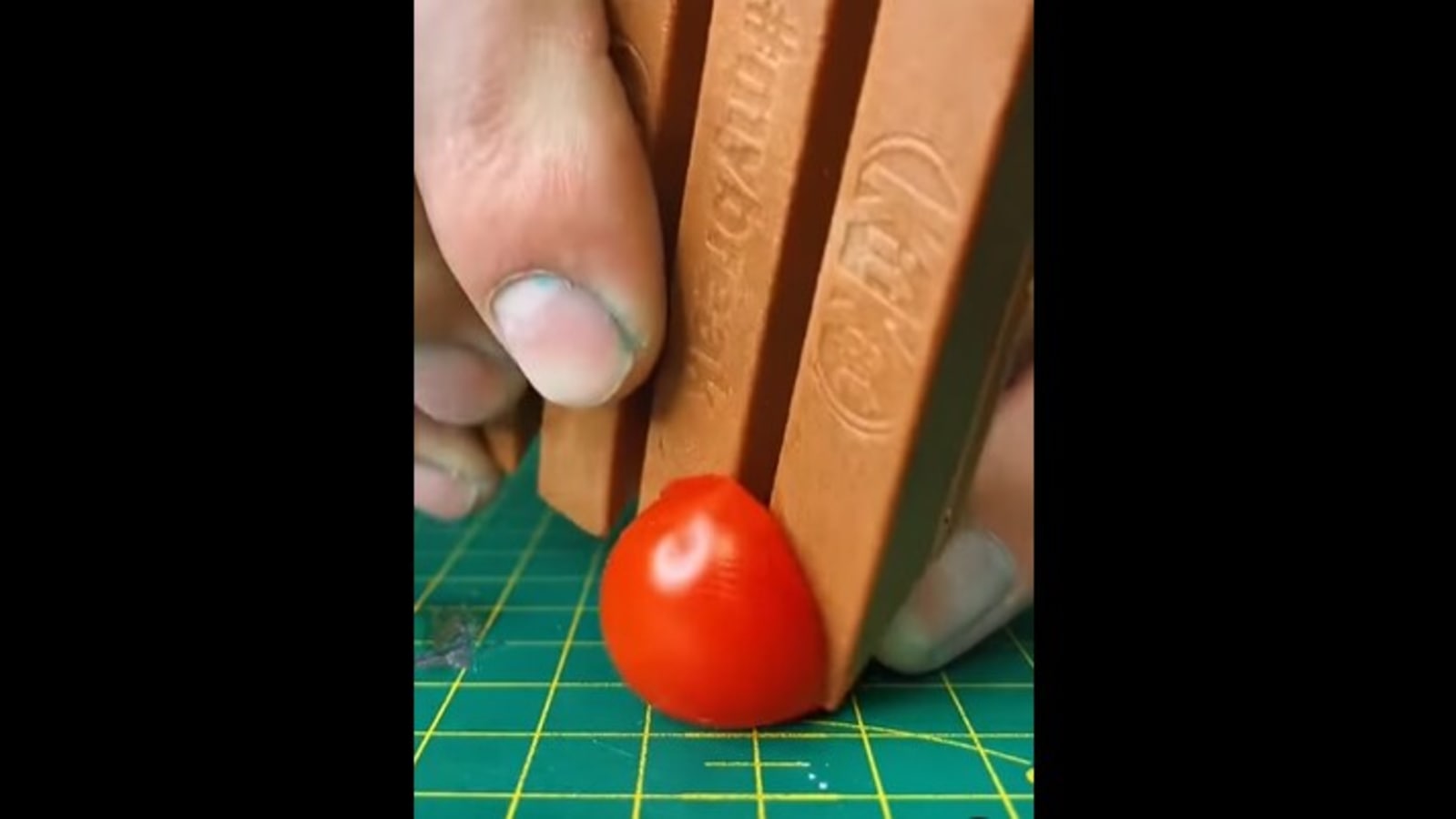Man sharpens KitKat, uses it as a knife to cut tomato. Watch ...