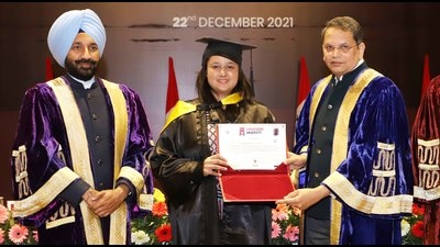 A student receiving her degree during the annual convocation of Chandigarh University in Gharuan, Mohali, on Wednesday. (HT Photo)