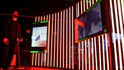 People look at non fungible token (NFT) art at Dreamverse, a public digital art experience featuring NFT artworks and artists in New York City, New York, US (REUTERS)