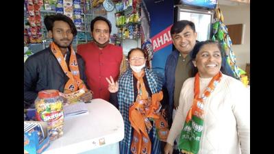 BJP workers canvassing door to door for their candidate Jasmanpreet Singh in Sector 44 on Wednesday. (HT Photo)