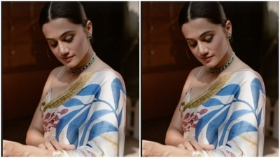 Styled by fashion stylist Devki, Taapsee wore her hair into a clean bun with a middle part. (Instagram/@taapsee)