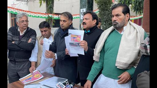 Congress leaders holding a press conference regarding the pre-poll survey in Chandigarh on Wednesday. (HT Photo)