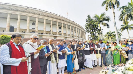 Opposition leaders along with suspended MPs read the Preamble to the Constitution of India and recite the national anthem, in front of Mahatma Gandhi statue, at Parliament in New Delhi on Wednesday. (PTI)